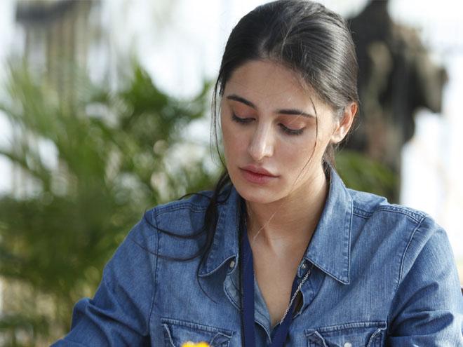 Why are Nargis Fakhri's dialogues subtitled in Madras Cafe?