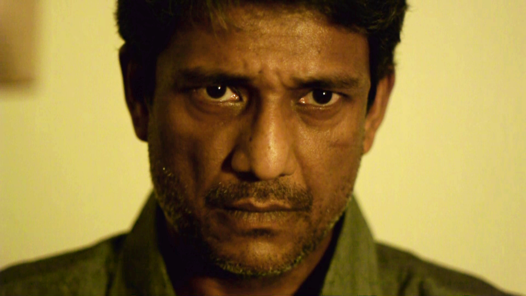Adil Hussain serious look