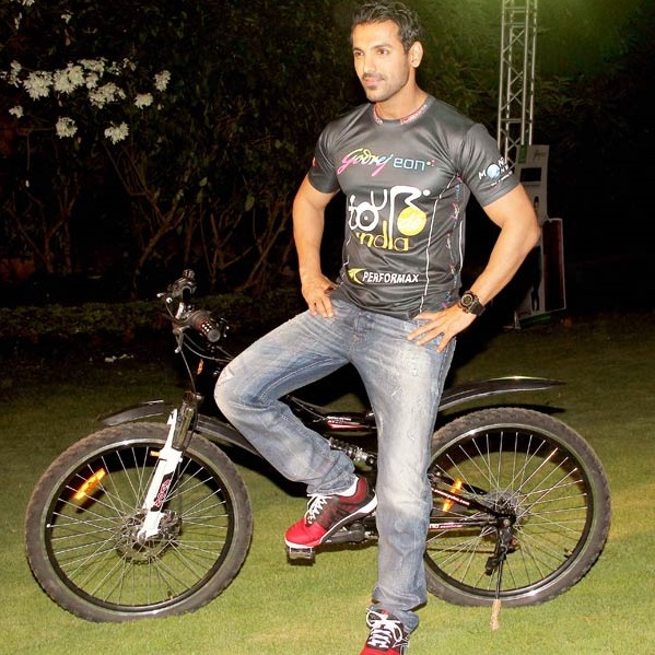 John Abraham riding bicycle