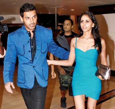 John Abraham with his wife
