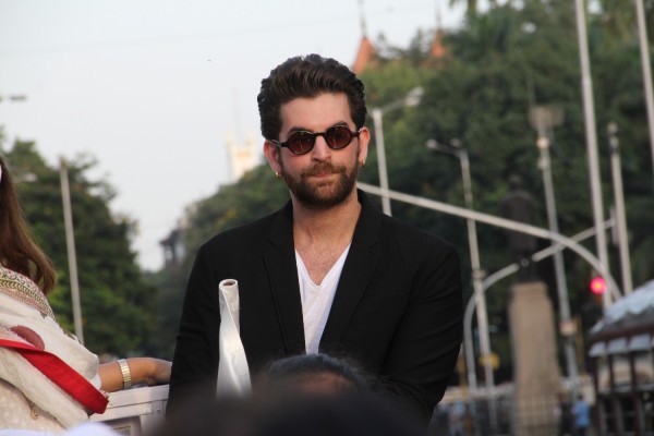 Neil Nitin Mukesh in black suite.
