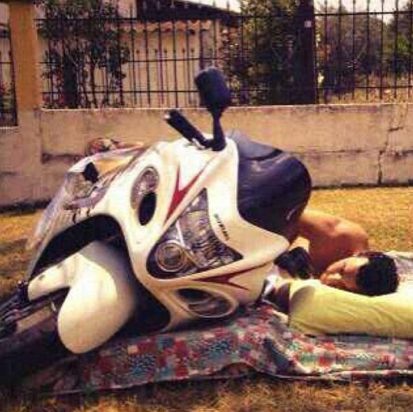 John Abraham sleeping with his favorite bike