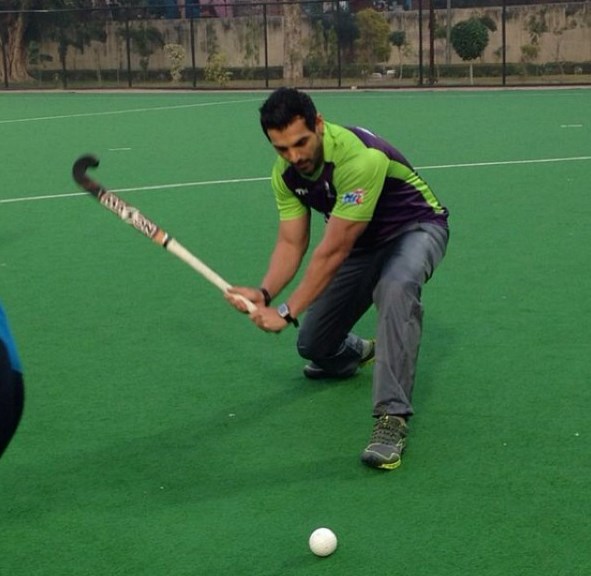 John Abraham playing hockey