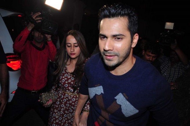 Varun Dhawan dressed in blue jersey with Natasha Dalal at Anil Kapoor Birthday Bash