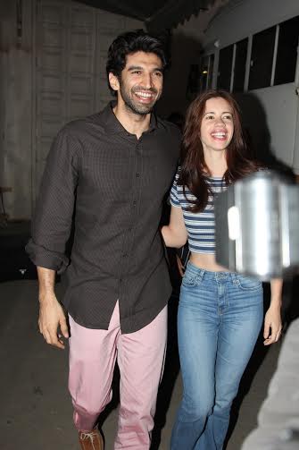 Aditya Roy Kapur in pink pants and brown shirt with Kalki Koechlin in Mehboob studio