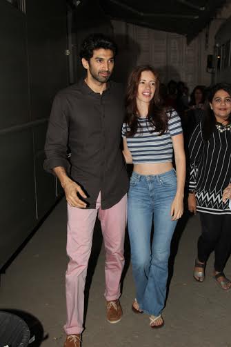 Aditya Roy Kapur in pink pants and brown shirt with Kalki Koechlin in Mehboob studio