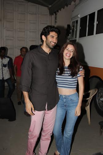 Aditya Roy Kapur in pink pants and brown shirt with Kalki Koechlin in Mehboob studio