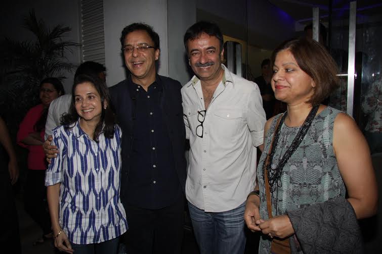 Rajkummar Hirani, Vidhu Vinod Chopra with wife at Saala Khadoos screeing