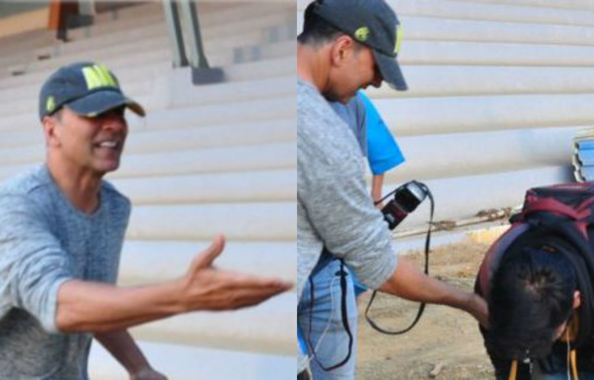 Akshay Kumar helps a photographer