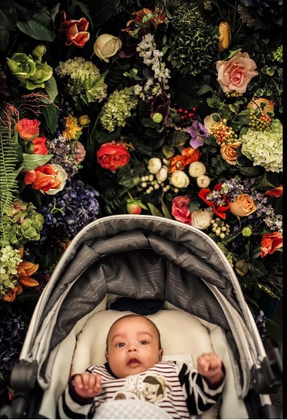 Lovely flowers surrounding the baby