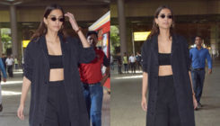 Lady in black, Sonam Kapoor's bare midriff is hogging all the glory at the airport. View Pics!