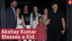 Akshay Kumar blesses a kid outside the Yauatcha in Mumbai