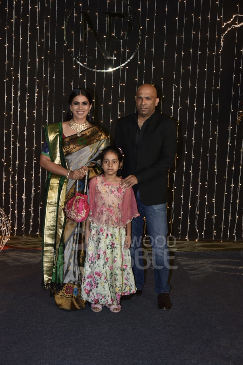 Sonali Kulkarni with her husband and daughter