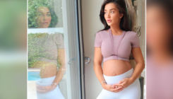 Amy Jackson hits back at a troll who criticises for 'cradling her belly'