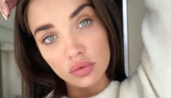 Amy Jackson shares a striking topless picture flaunting her baby bump
