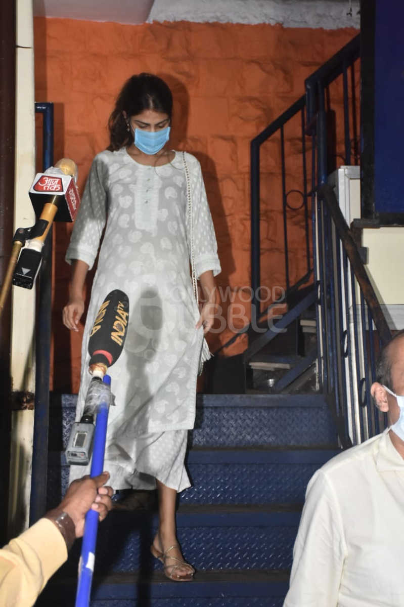 Rhea leaving after interrogation