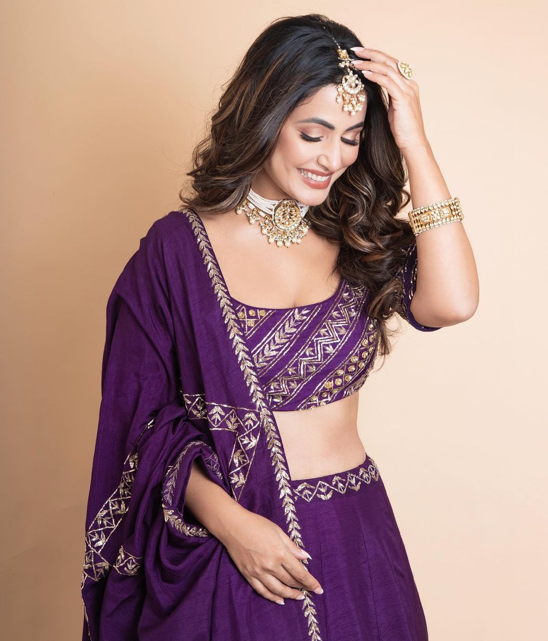 Hina Khan in purple lehenga