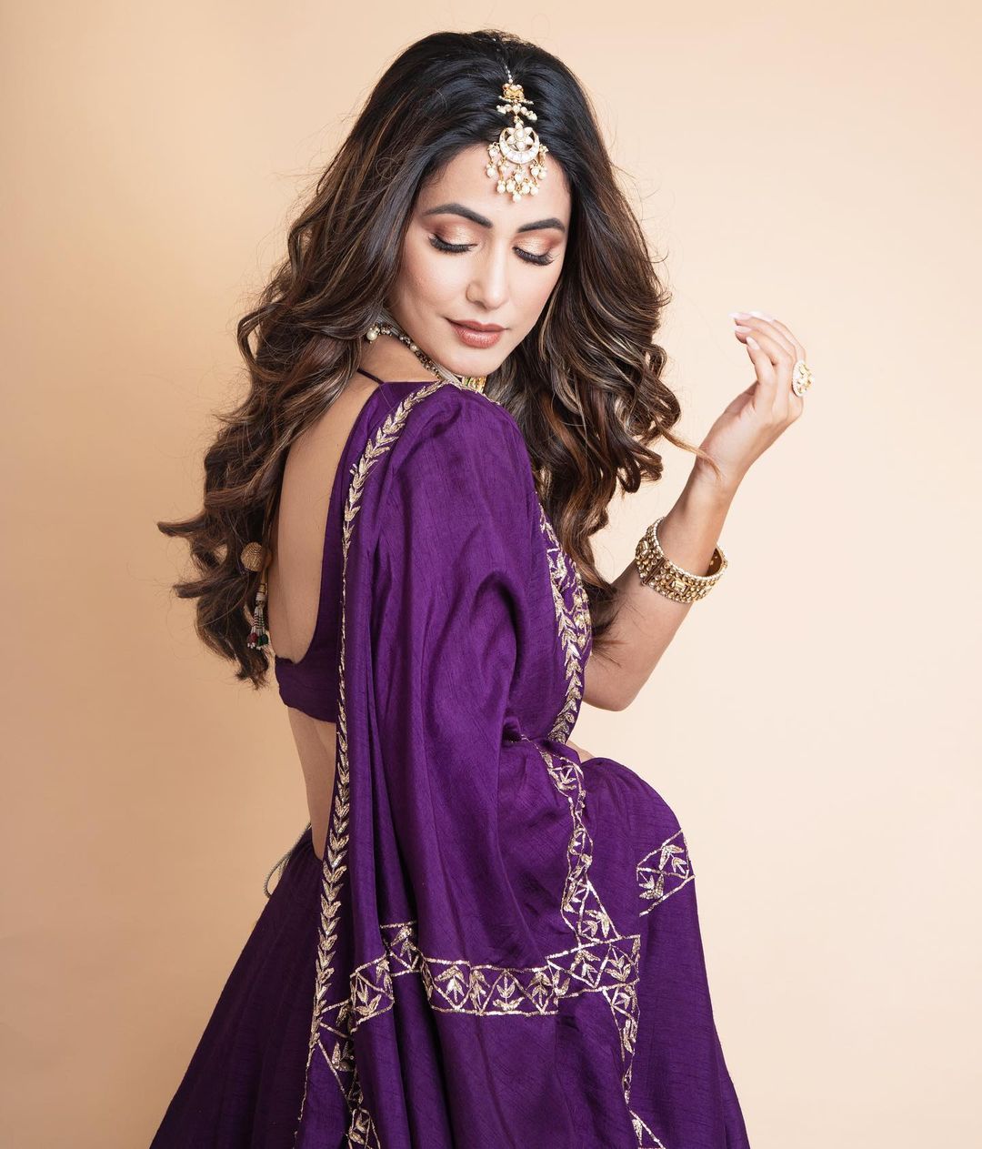 Hina Khan in purple lehenga