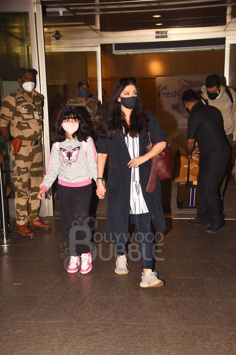Aishwarya Rai Bachchan, Abhishek Bachchan and Aaradhya airport