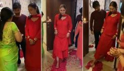Newlywed Disha Parmar receives warm welcome by Rahul Vaidya's family as they shower her with rose petals; watch VIRAL videos