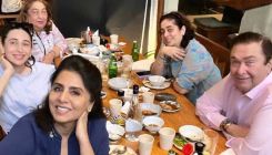Neetu Kapoor smiles for a family photo as she enjoys lunch with Randhir Kapoor, Karisma