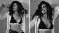 Karishma Tanna oozes hotness as she shows off her lingerie in an open white shirt and unzipped denims