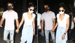 As Deepika Padukone, Ranveer Singh walk hand-in-hand at the airport, Paparazzo trips while clicking- WATCH
