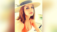 Sussanne Khan sizzles in a sexy orange bikini as she enjoys her pool day