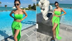 Mouni Roy oozes summer vibes this winter as she sizzles in a strapless green top and thigh-slit skirt