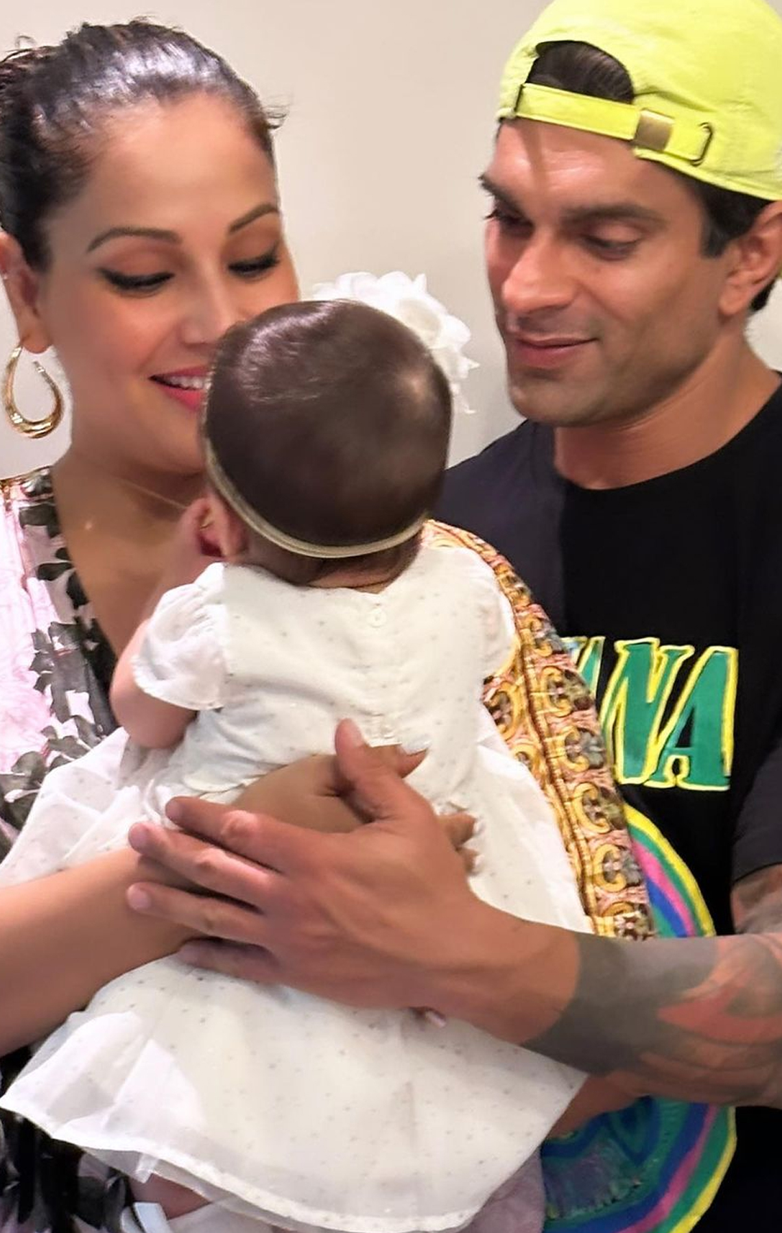 The couple is all smiles adoring their baby girl