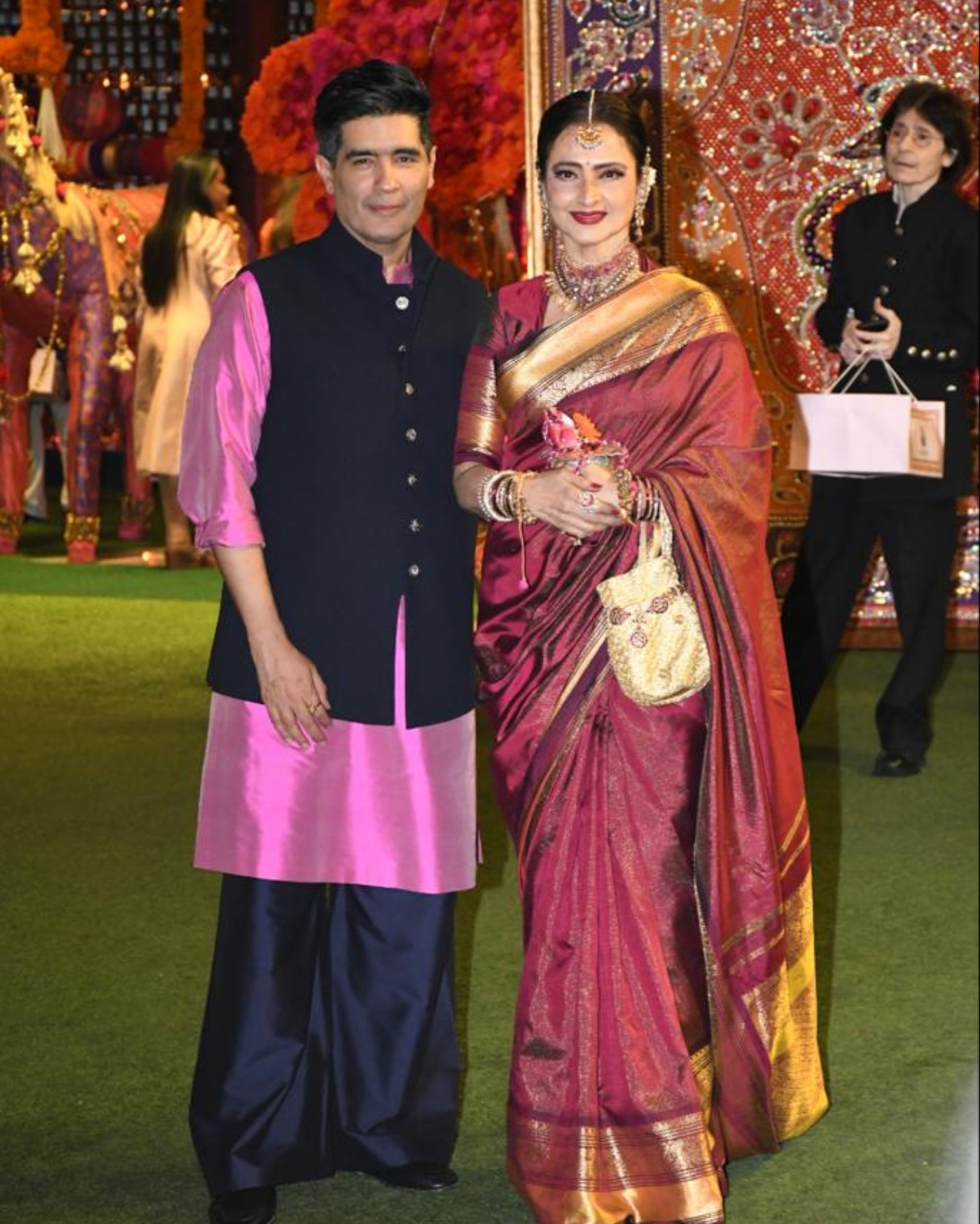 Rekha and Manish Malhotra are all smiles as they arrive for Ganesh Chaturthi celebrations at The Ambanis