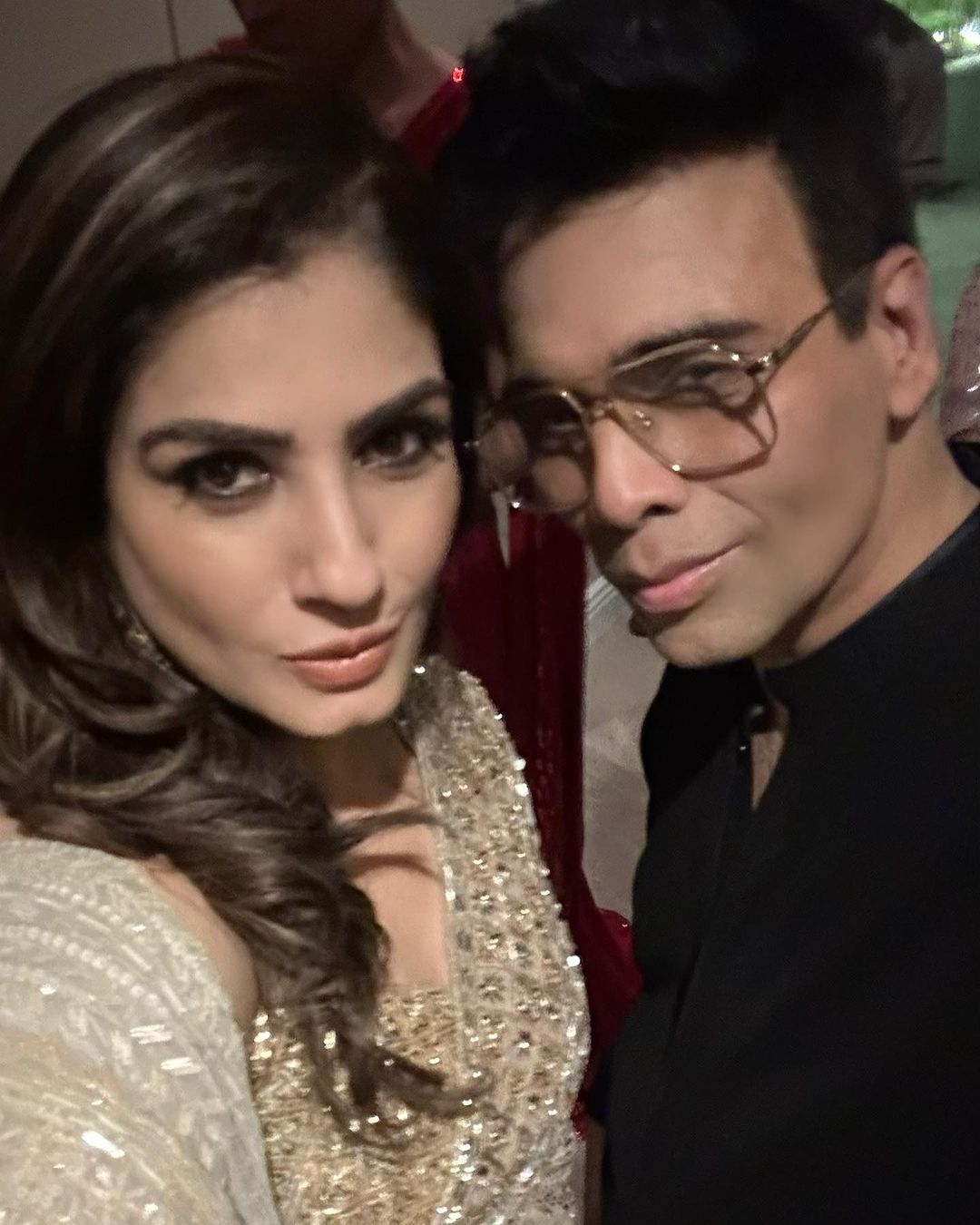 Raveena Tandon poses with Karan Johar