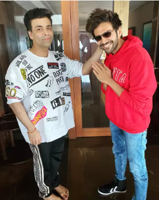 Karan Johar pulling Kartik Aaryan's ear