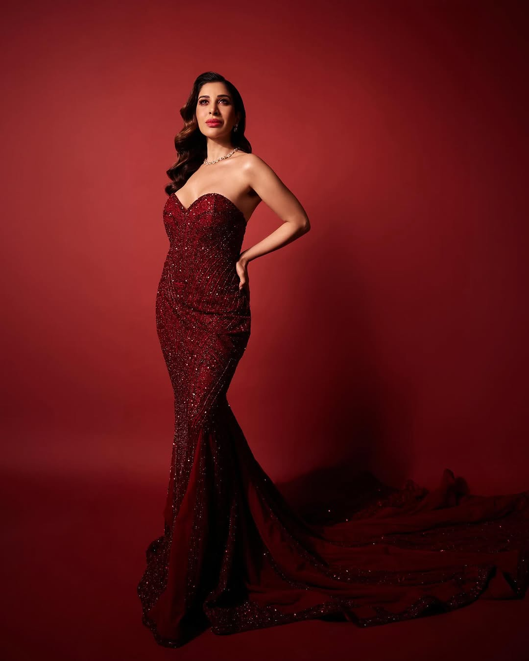 Sophie Choudry In A Classic Red Strapless Gown